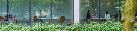 Students sitting by the window of the QNC building